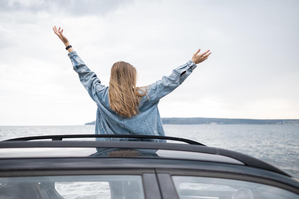 pretty young woman enjoying road trip 20 road trip guide
