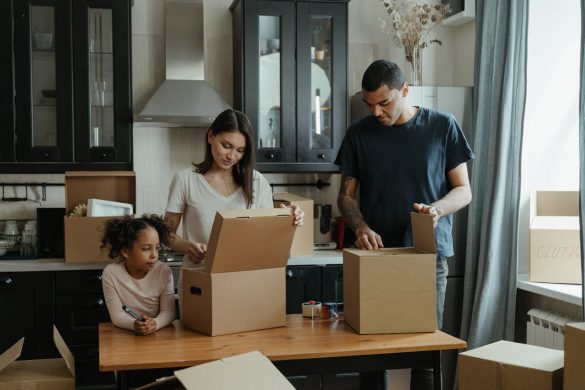 a family with moving boxes reducing waste when unpacking